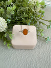 Orange Stone Center with White Topaz Sides